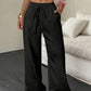 Pantalones de pierna ancha de color sólido con arrugas